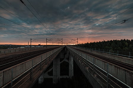 landscape photography of trainway during sunset thumbnail