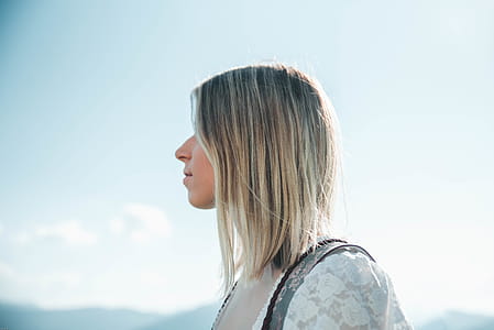Woman Wearing White Lace Top thumbnail