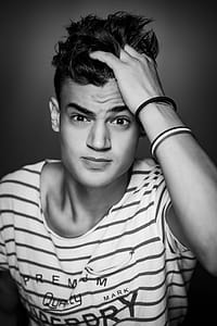Man Wearing White and Black Striped T-shirt thumbnail