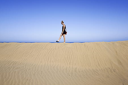 person walking on desert thumbnail