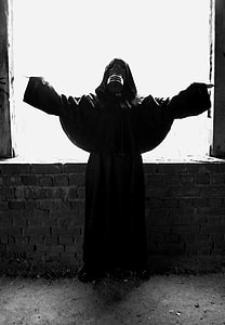 person wearing gas mask and robe thumbnail