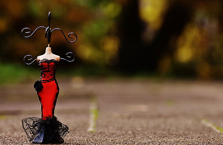selective focus photograph of doll jewelry stand thumbnail