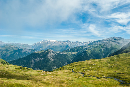 aerial photo of green field near mountain ranges thumbnail