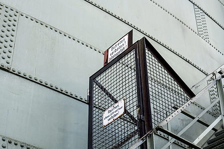 low angle photography of building exit ladder thumbnail