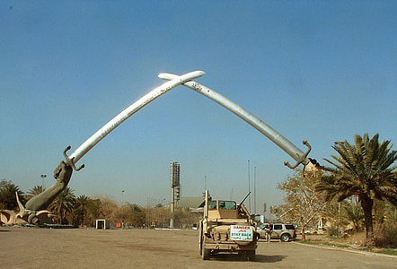 gray truck on road with two hands holding swords arch thumbnail