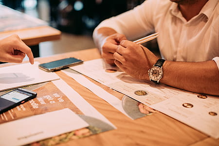 Person Leaning On Wooden Table thumbnail