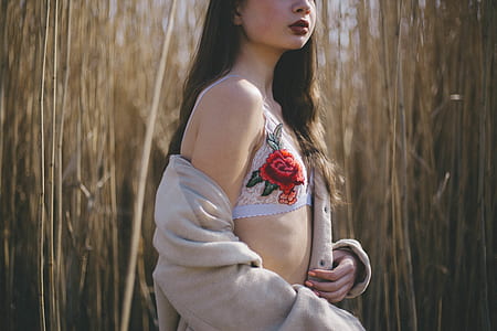 woman wearing gray jacket near grass thumbnail