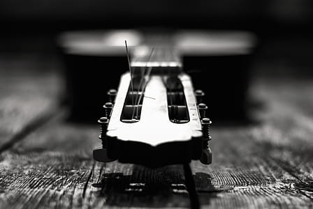 Grayscale Photography Of Guitar thumbnail