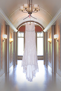 white spaghetti strap high low dress hanged on uplight chanedlier thumbnail