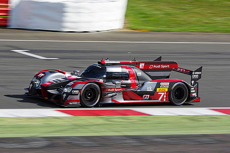 red and gray coupe on race track thumbnail
