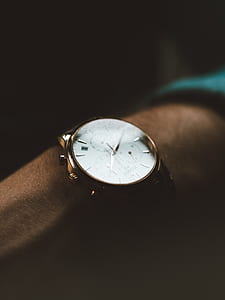 round gold-colored chronograph watch with link band thumbnail