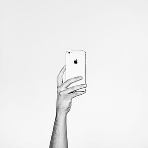 person holding iPhone 6 thumbnail