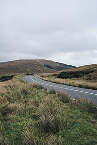 road near mountains thumbnail