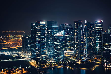 aerial photo of city high rise building at night time thumbnail