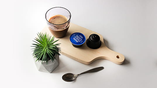 coffee pod on brown serving board thumbnail