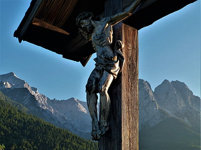 wooden cross decor near green mountain thumbnail