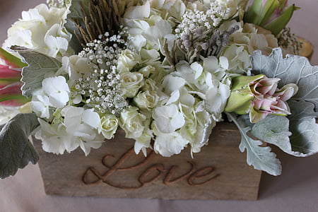 assorted-color flower decor on brown wooden box thumbnail