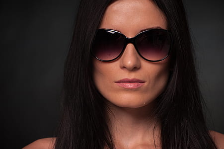 woman wearing black oversize sunglasses thumbnail