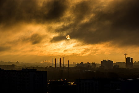 aerial photography of silhouette of city under full moon thumbnail