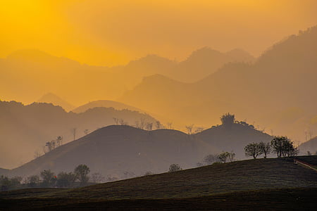 silhouette of mountain with trees during sunset thumbnail