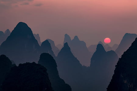 silhouette of mountains during sunset thumbnail