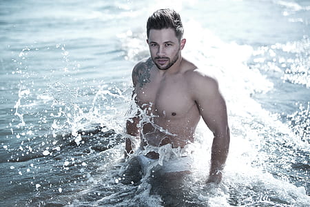 Photo of Man in Body of Water Wearing White Brief thumbnail