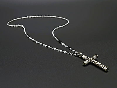 silver-colored necklace with cross pendant thumbnail