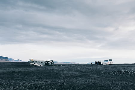 group of people gathered near white van thumbnail