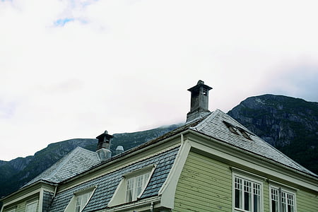 beige and gray residential house near mountain thumbnail