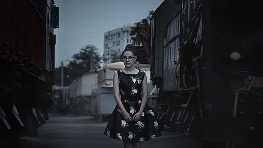 woman in black and white floral sleeveless dress thumbnail