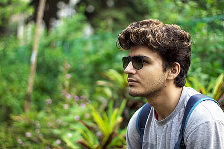 Man Wearing Sunglasses and Grey Shirt Taking Selfie at the Forest thumbnail