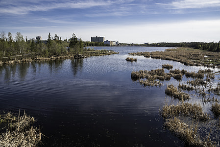 Buildings and landscape across Niven Lake in Yellowknife thumbnail