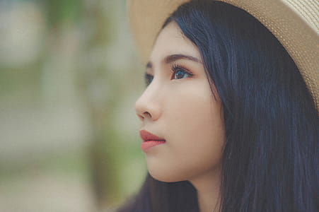 Woman Wearing Brown Fedora Hat thumbnail