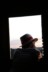 woman looking at the window thumbnail