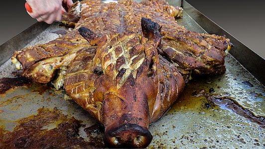 roasted pig on gray stainless steel surface thumbnail