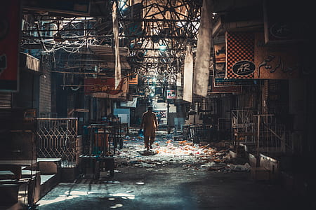 person passing by street surrounded with garbage thumbnail