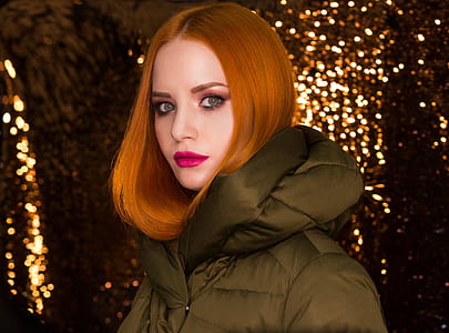 woman wearing puffer jacket with bokeh background thumbnail