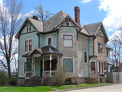 white and blue wooden 3-storey house during daytime thumbnail