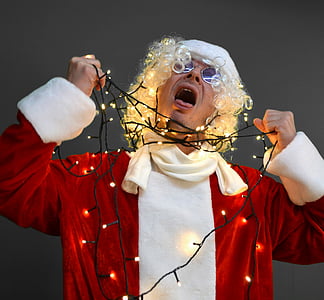 man in white Santa Claus costume choking himself using string lights thumbnail