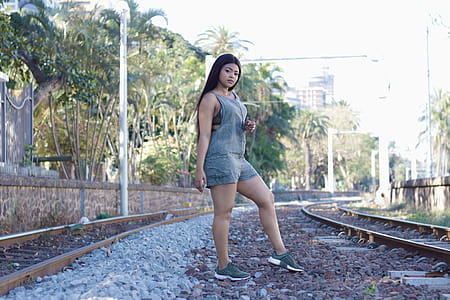 Woman Standing Between Railways thumbnail