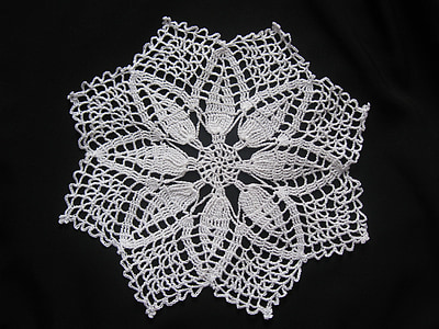 selective focus photo of white floral table mat thumbnail