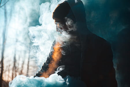 person smoking and wearing hoodie thumbnail