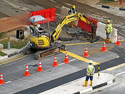 orange traffic cone on gray concrete road thumbnail