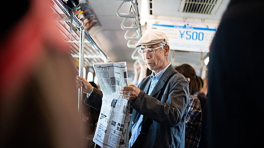 men reading newspaper thumbnail