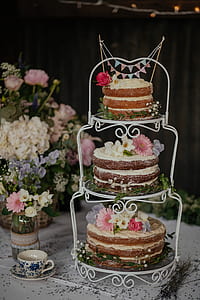 three layered cakes on table thumbnail