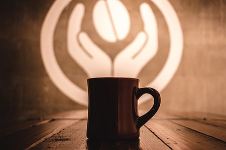 Coffee mug on table in cafe thumbnail