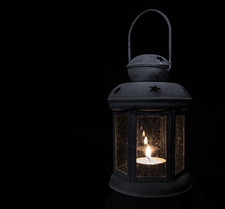 white tealight in white lantern lamp thumbnail