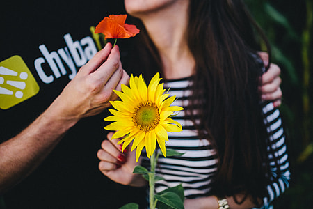 Young couple with sunflower thumbnail