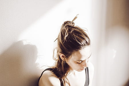 woman sitting wearing gray tank top thumbnail