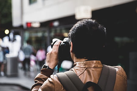 man wearing brown jacket thumbnail
